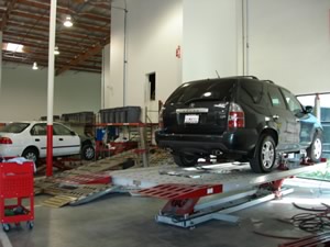 Car being repaired on our frame machine